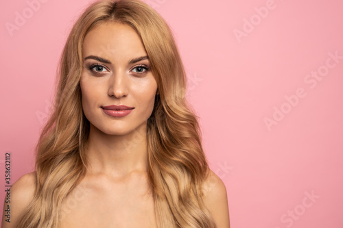 Portrait of pretty, gorgeous girl with problem oil dry face skin, plump lips, isolated on pink background, hygiene, correction, nutrition, rejuvenation concept. free space for logo or text