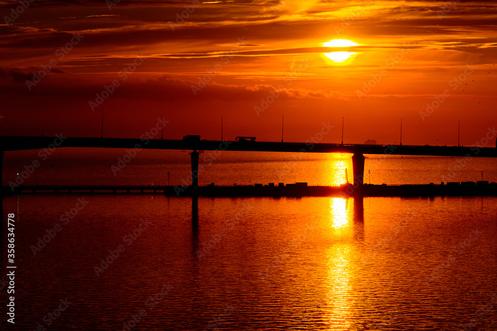Bridge on the Sunset over the sea in Russia