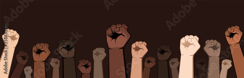 Many raised fists of different shades.
