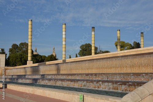 Columns with a cascade water fountain captured in Joan Maragall Garden in Barcelona, â€‹â€‹Spain photo