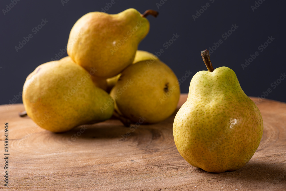 .Pears. Some pears together on wooden background .Pears. Some pears together on wooden background