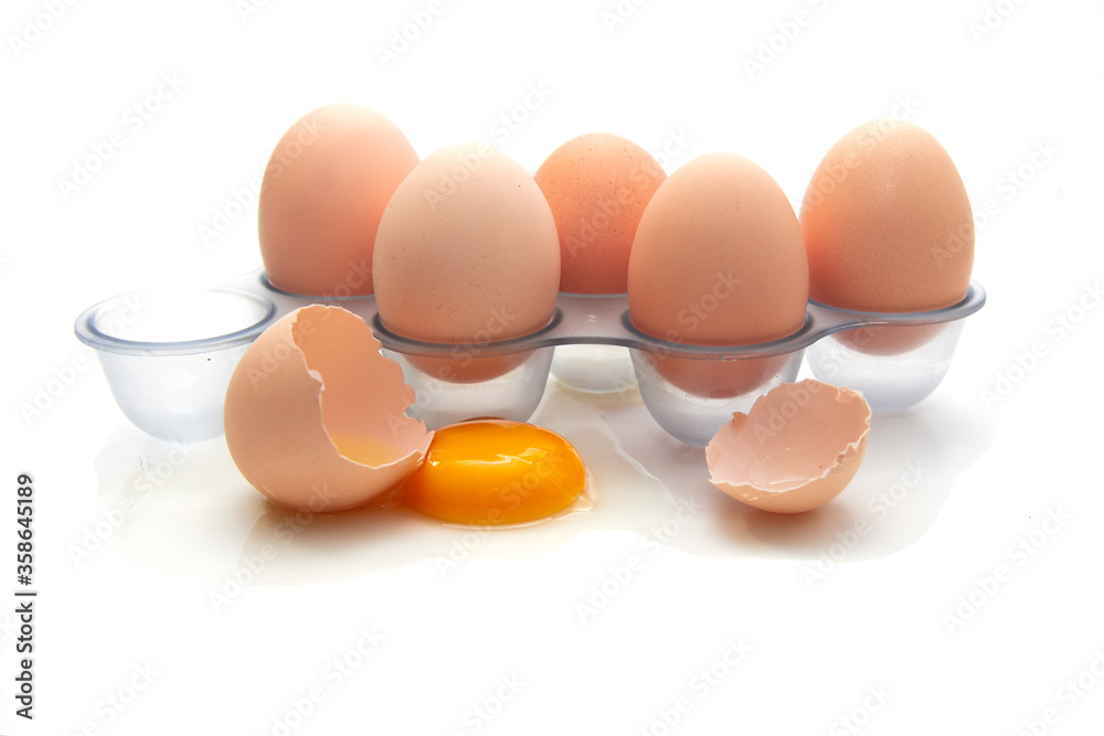 Fresh Eggs in the refrigerator tray. Six homemade eggs. White background. isolate. Fresh Eggs in the refrigerator tray. Six homemade eggs. White background. isolate.