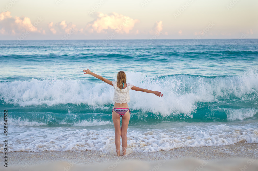 Beautiful blonde girl on the beautiful beach of the island of Cozumel, Mexico Beautiful blonde girl on the beautiful beach of the island of Cozumel, Mexico