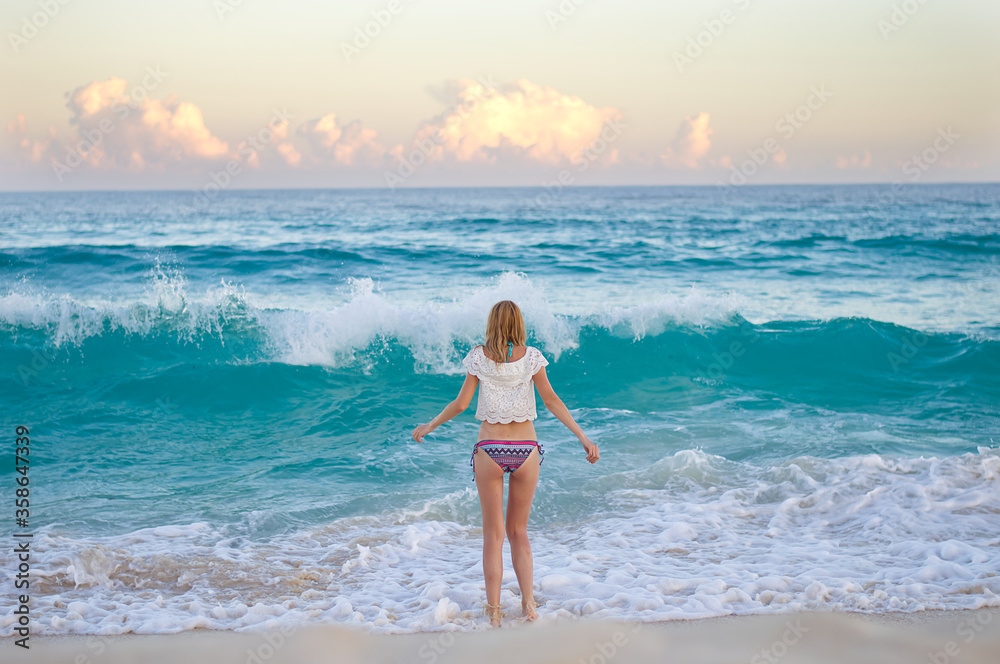Beautiful blonde girl on the beautiful beach of the island of Cozumel, Mexico Beautiful blonde girl on the beautiful beach of the island of Cozumel, Mexico