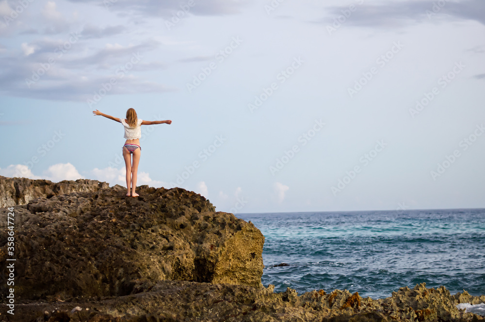 Beautiful blonde girl on the beautiful beach of the island of Cozumel, Mexico