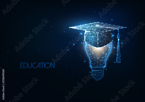 Futuristic academic education, graduation concept with glowing low polygonal graduating cap and light bulb photo