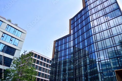 Facade texture of a glass mirrored office building. Fragment of the facade. Modern architecture of the office building.