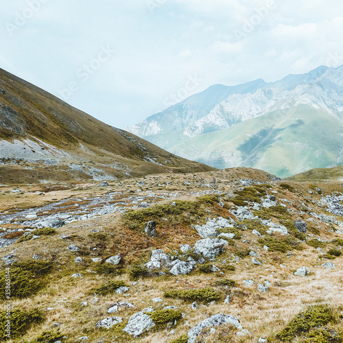 Picturesque mountain scenery with cumulus clouds. Wildlife. Hiking. Daytime. national park