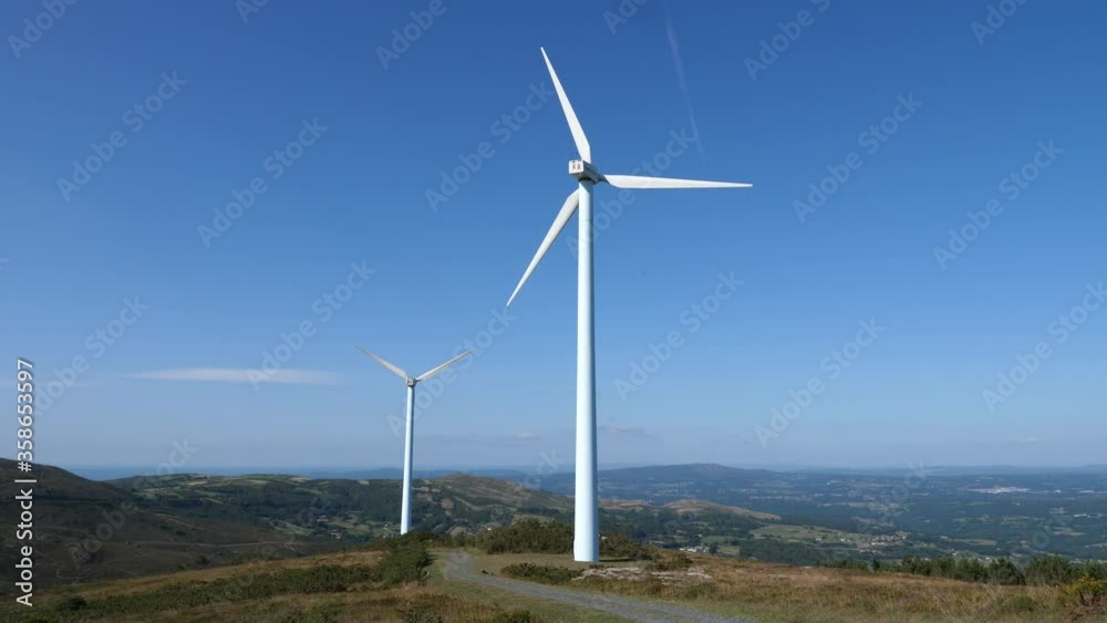 Wind turbines producing renewable energy. Wind turbines producing renewable energy.