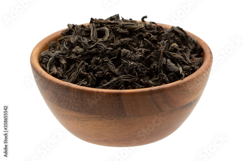 Black tea in a wooden bowl.