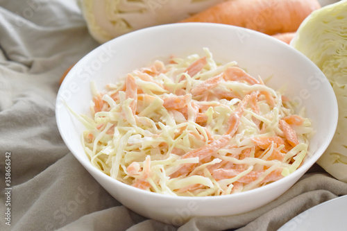 Coleslaw salad with cabbage and carrot. Healthy and dietary food concept. 