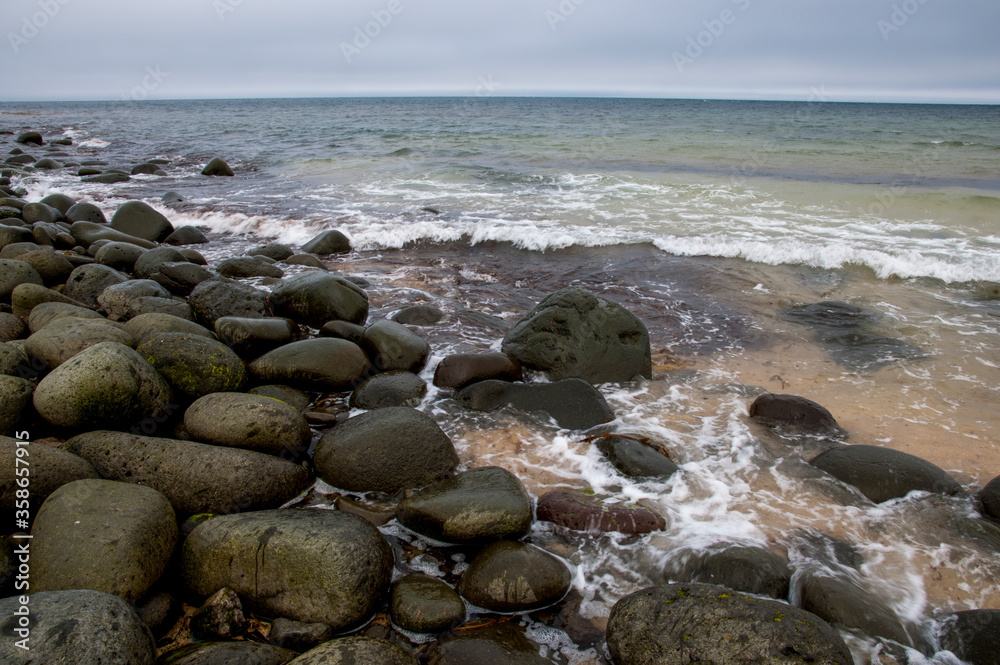 black pebbles on sandy beach iceland west fjords