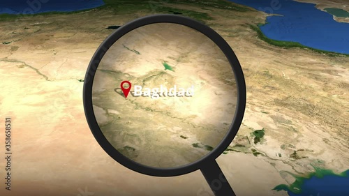 Magnifying glass finds Baghdad city on the map photo