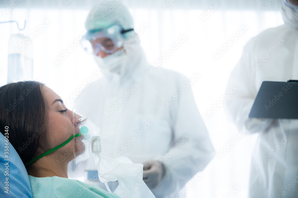 virus control experts doctor working for disease treatment with coronavirus COVID-19 infected patient people in hospital quarantine negative pressure room, PPE suit uniform virus control experts doctor working for disease treatment with coronavirus COVID-19 infected patient people in hospital quarantine negative pressure room, PPE suit uniform