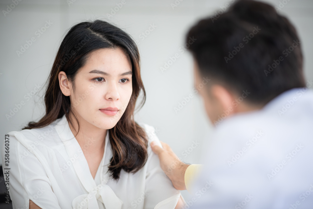 Mental health concept, Close-up of psychologist comforting his depressed patient, Doctor (psychiatrist) consultation and diagnostic examining woman patient Mental health concept, Close-up of psychologist comforting his depressed patient, Doctor (psychiatrist) consultation and diagnostic examining woman patient