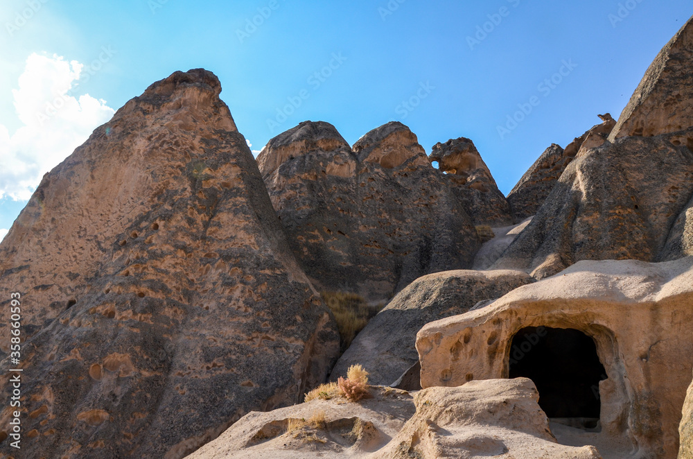 The caves of the ancient rock monastery of Selime, carved into the mountains in the valley of Ihlara, Cappadocia, Turkey