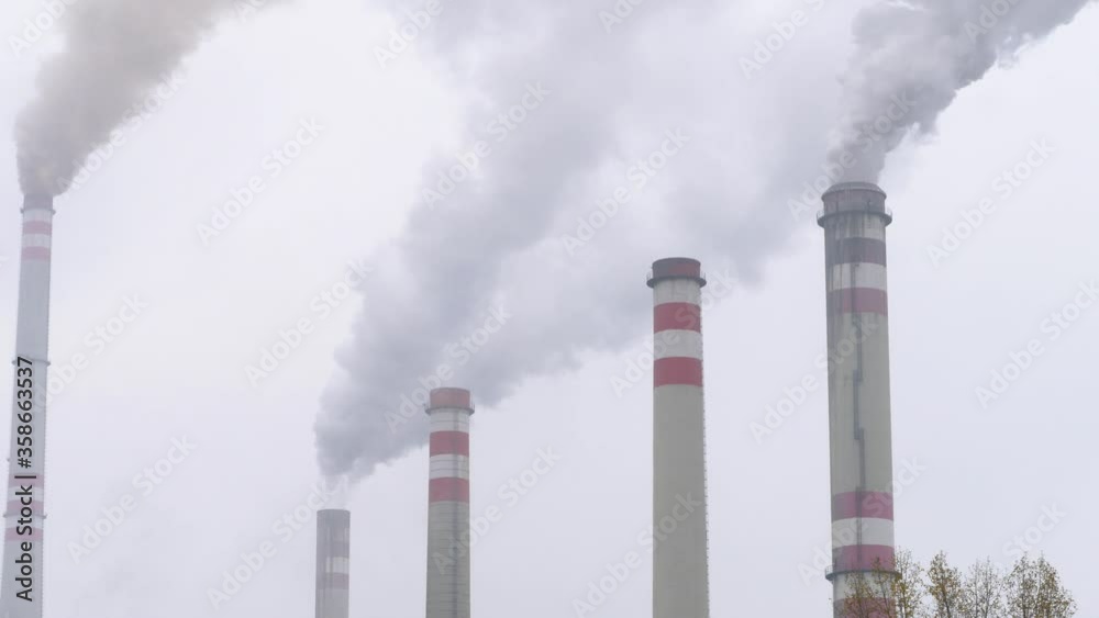 Power plant smoke stacks polluting the environment Power plant smoke stacks polluting the environment