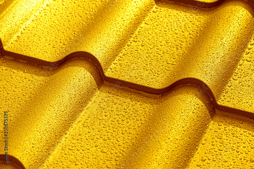 Metallic roof with drops of water.