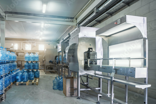Industrial interior of water plant or factory production. Beverage factory, industry production line.