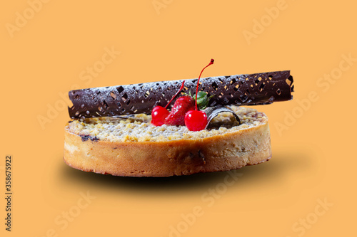 Pastei or Pie. Peanut chocolate pie is a food consisting of the skin of a cookie and the contents of chocolate beans, decorated with strawberries, cherries, chocolate garnish. photo