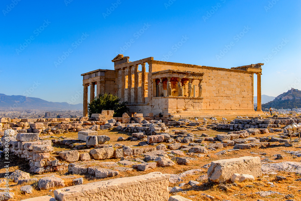 It's Erechtheion or Erechtheum, A Greek temple dedicated to both Athena and Poseidon. Acropolis of Athens. UNESCO World Hetiage site.