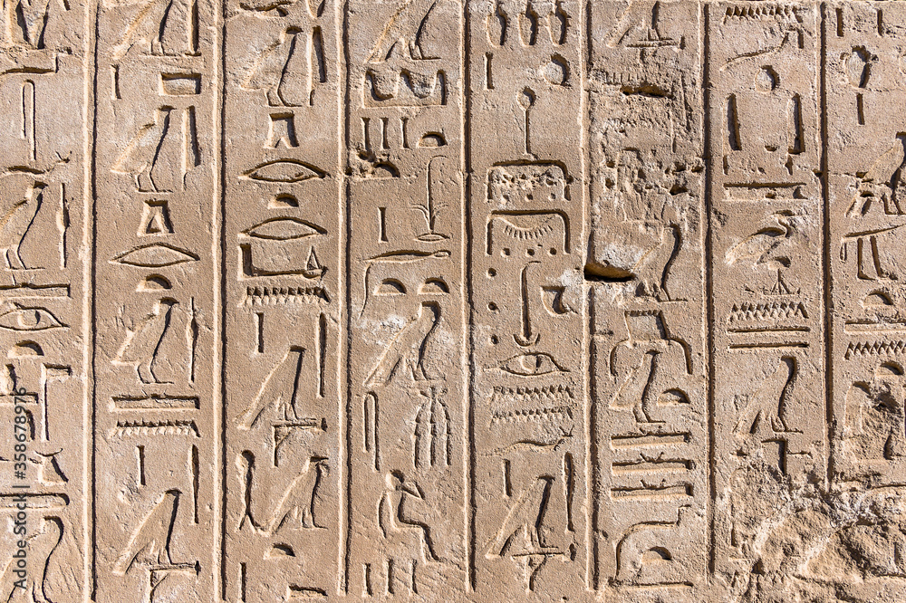 It's Ancient Hieroglyphs of the Karnak temple, Luxor, Egypt (Ancient Thebes with its Necropolis). It's Ancient Hieroglyphs of the Karnak temple, Luxor, Egypt (Ancient Thebes with its Necropolis).
