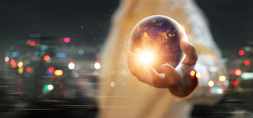 Earth at night was holding in human hand, Earth day, Energy saving concept