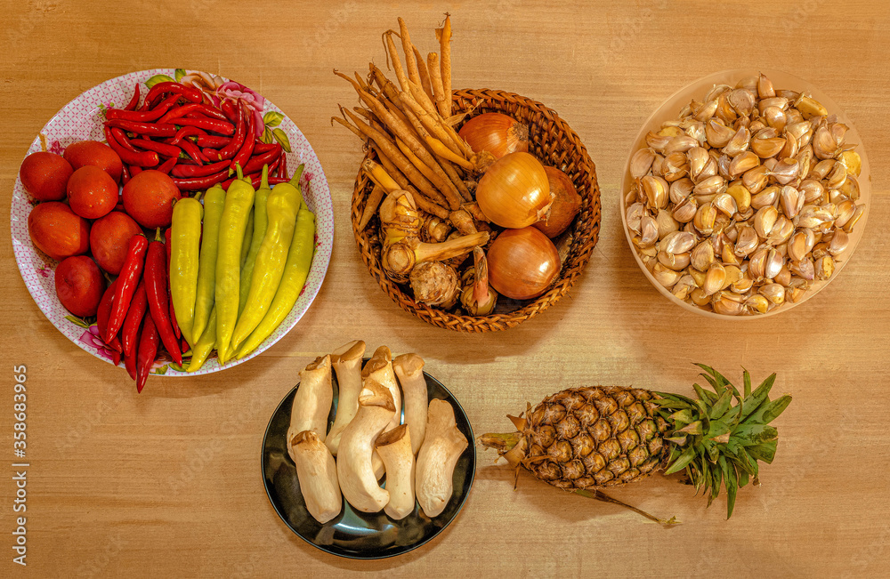 The ingredients for Thai cuisine; Onions,Galangals, Fingerroots (Chinese's Ginger), Red chili spur pepper,Green capsicums,Red bird’s eye chili,Tomatoes,Garlic,Pineapple and Yanagi Mutsutake mushroom The ingredients for Thai cuisine; Onions,Galangals, Fingerroots (Chinese's Ginger), Red chili spur pepper,Green capsicums,Red bird’s eye chili,Tomatoes,Garlic,Pineapple and Yanagi Mutsutake mushroom