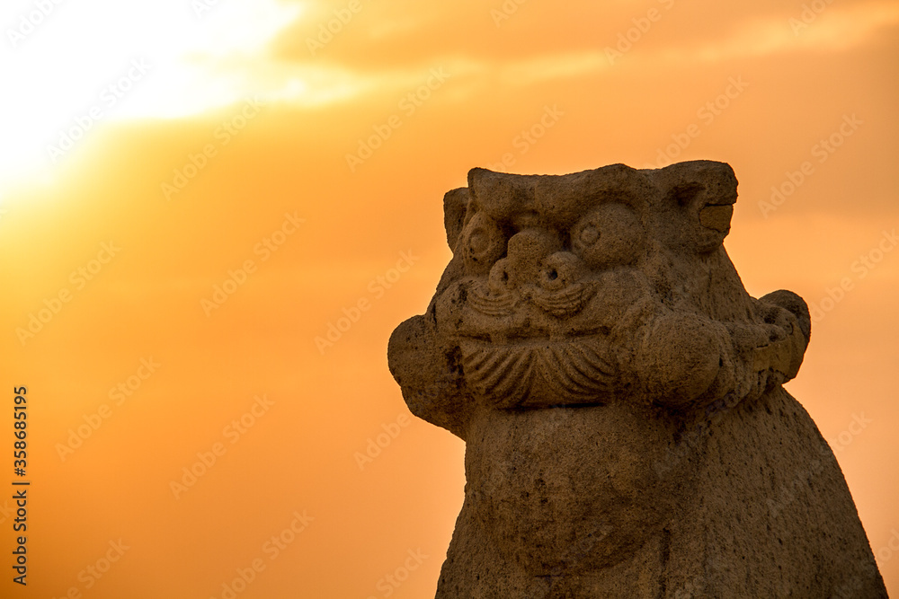 Okinawan lion dog statue in the Chura Sea in Okinawa at sunset_01