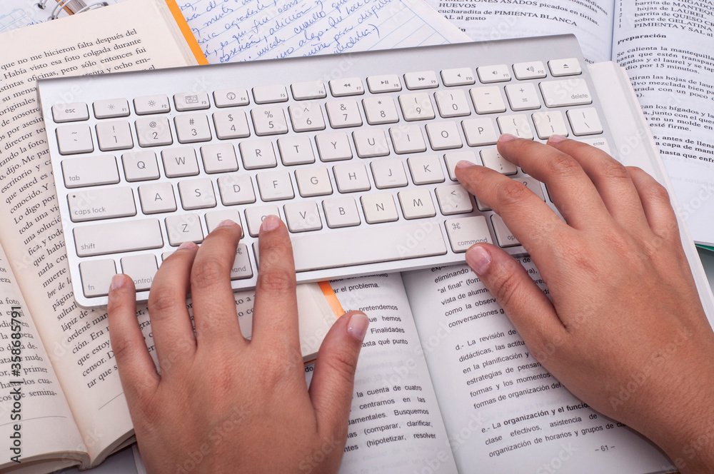female hands typing on keyboard female hands typing on keyboard