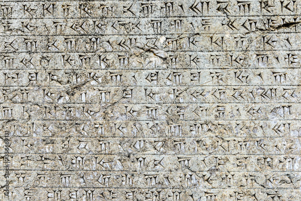 It's Relief of the ancient alphabet. Persepolis, the ceremonial capital of the Achaemenid Empire. UNESCO World Heritage