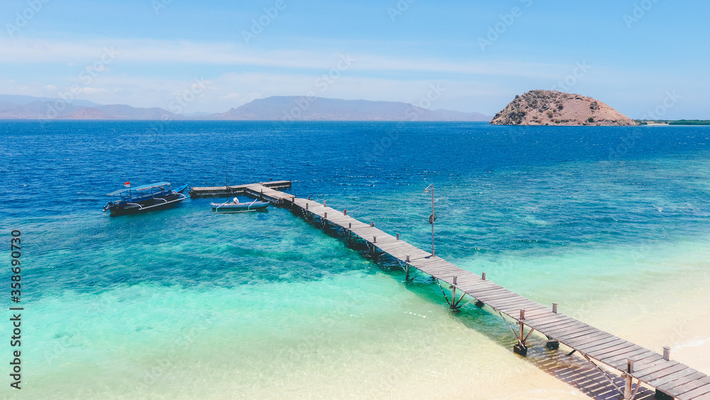 Aerial view of a small wooden pier at in Paserang Island, Sumbawa, Indonesia