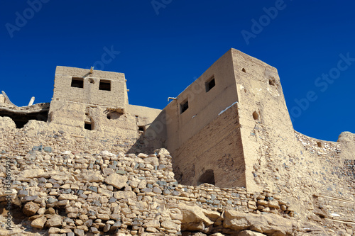 It's Ruins of a fortress in the abandoned village Taganrut in winter (Mountain Lake) in Iran