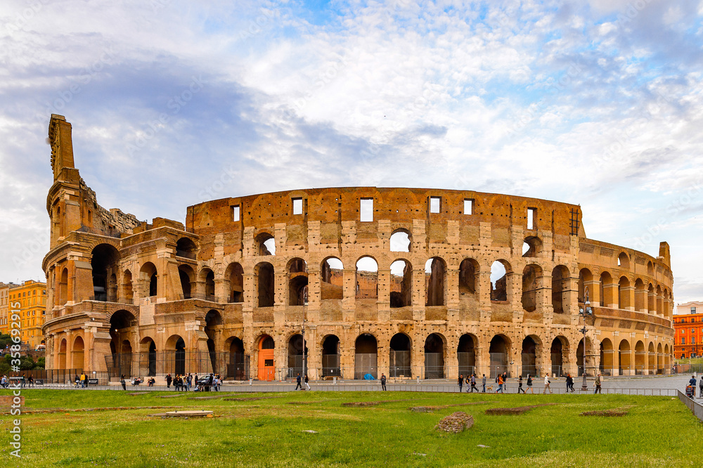 It's Panoramic view of Colosseum or Coliseum in the evening, Rome, Italy. One of the main touristic destinations in Rome