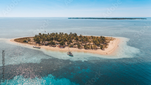 Aerial view of Bedil Island, the small island with palm tree and white sands in Sumbawa, Indonesia photo