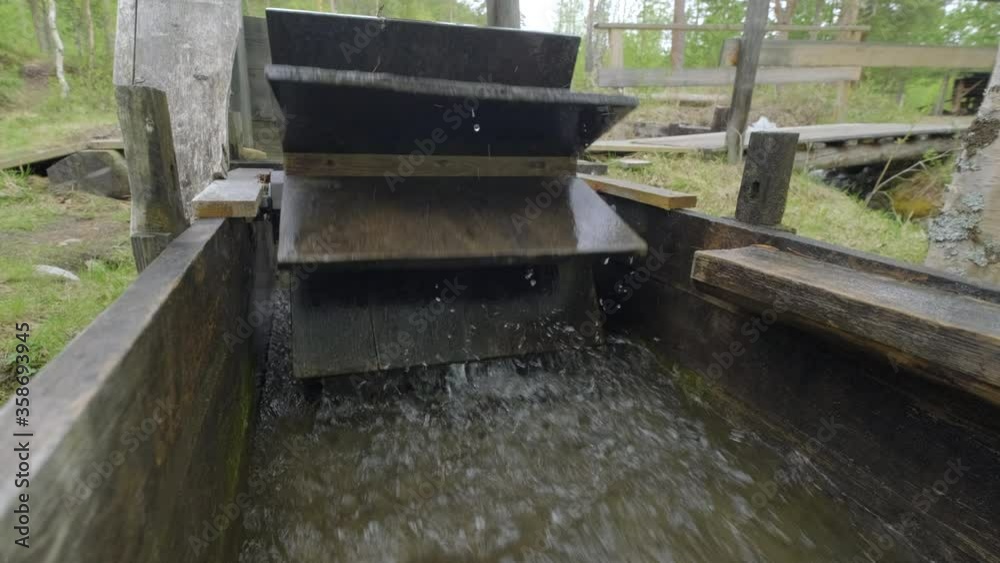 Small scale water mill in the forest Small scale water mill in the forest