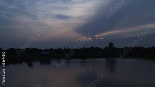 Evening Sunset in Blue Sky and Puffy Clouds Over the Lake Full HD Timelapse