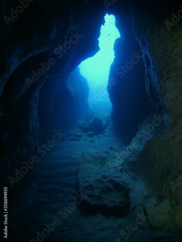  exploring a cave cavern eneterance under water deep water ocean scenery