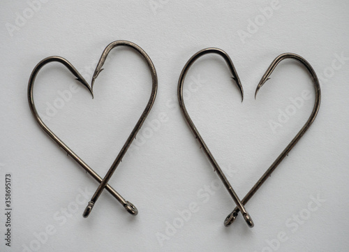 Big fishing hooks in the shape of hearts photo