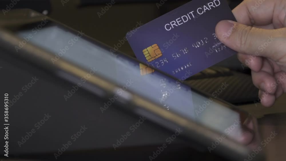 4K Video credit card touch on tablet screen. Video concept for mobile device and technology. 4K Video credit card touch on tablet screen. Video concept for mobile device and technology.