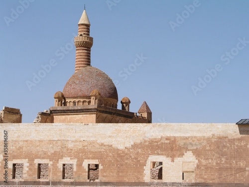 Beautiful view of the Ishak Pasha Palace DoÄŸubayazÄ±t in Turkey with brick walls surrounding it photo
