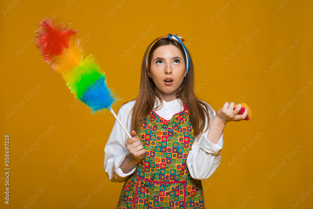 Angry housewife hold colorful duster brush. Cleaning service. Woman from cleaning service.Hygiene concept.