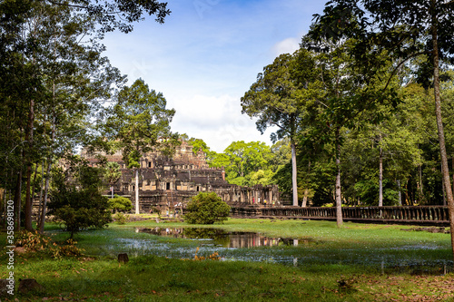 It's Baphuon, a temple at Angkor, Cambodia. Built as the state temple of Udayadityavarman II dedicated to the Hindu God Shiva.