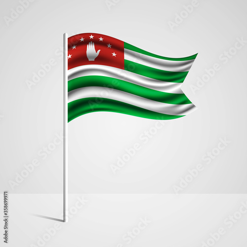 Realistic Abkhazia country flag waving in wind. Abstract country flag with flagpole isolated on grey background
