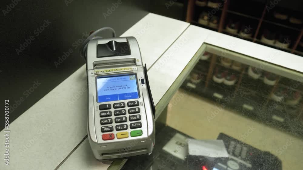 Used Credit Card Scanner On Old Bowling Center Counter Top, Closeup Dolly Out Used Credit Card Scanner On Old Bowling Center Counter Top, Closeup Dolly Out