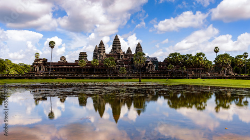 It s Angkor Wat  Temple City  and its reflection in the lake  a Buddhist  temple complex in Cambodia and the largest religious monument in the world. View from the garden