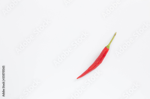 A lot of red hot chili peppers on a white background. a concept hot spice for food. top view, flat lay. Concept red food, .