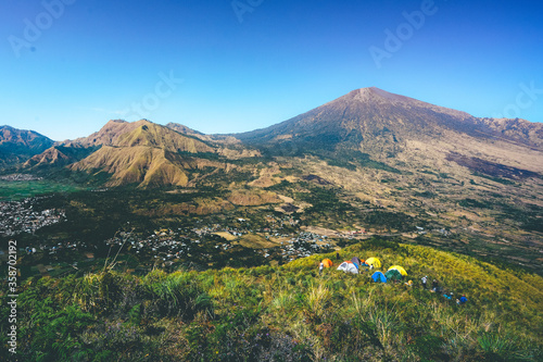 Pergasingan hill view with Mount Rinjani as the background in Lombok, Indonesia. Camping site.