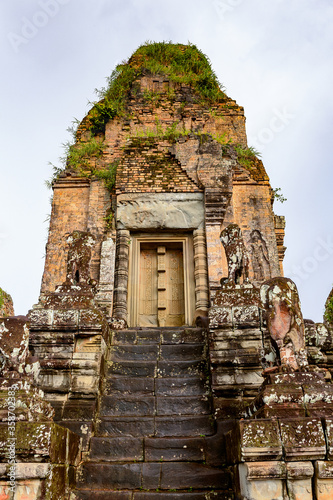 It's Pre Rup, a temple at Angkor, Cambodia, the state temple of Khmer king Rajendravarman. It is a temple mountain made of brick, laterite and sandstone construction. photo