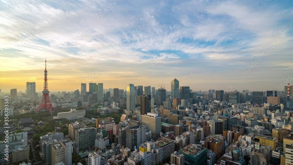 4K UHD time lapse day to night of Tokyo city skyline view and building at Japan with sunset and colorful skyline. Beautiful of cloud and sky in dusk and twillight.